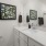 a spacious bathroom with a white vanity
