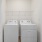 a laundry area with shelving