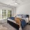 Bedroom with natural lighting and high ceilings