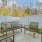 a deck with chairs and a table