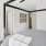 a bedroom with a ceiling fan