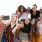 a group of people posing for a photo on a rooftop
